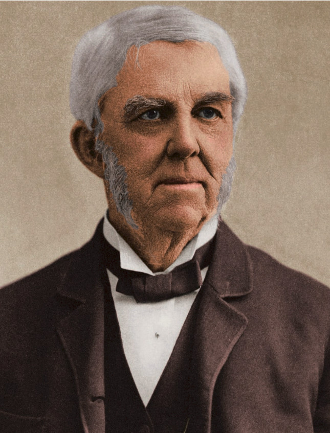 Retrato coloreado de un hombre mayor, de pelo gris y patillas prominentes, que encarna la idea de "la prevención como conducta inteligente". Lleva un traje oscuro con pajarita y chaleco, sobre un fondo neutro.